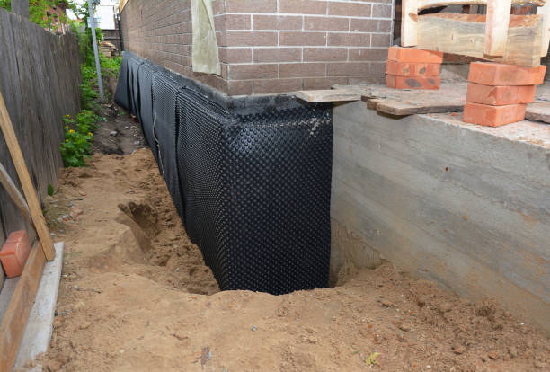 Happy homeowners after waterproofing job in Atwood